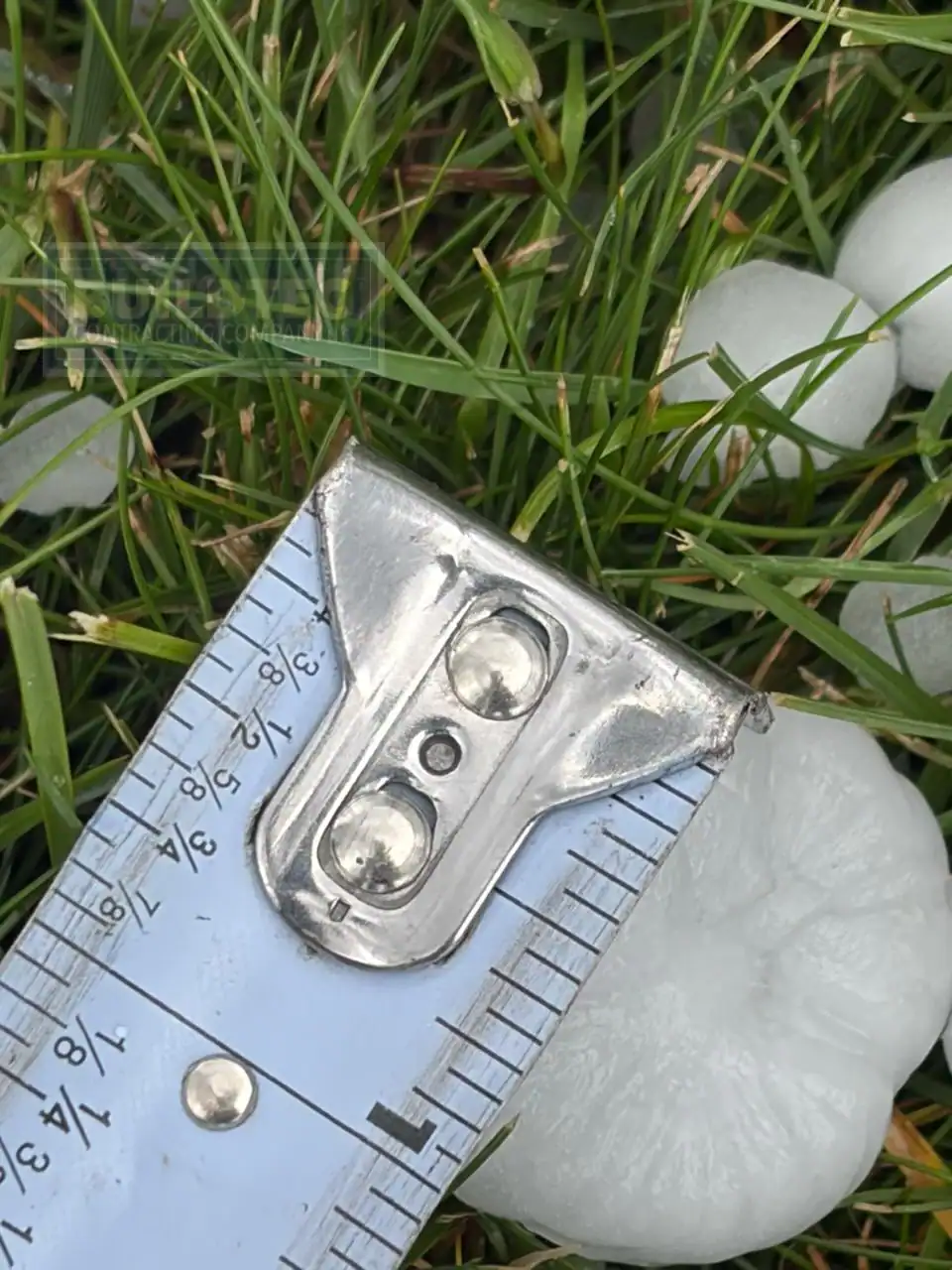 Tap measure up to hail measuring 1" in St Paul.