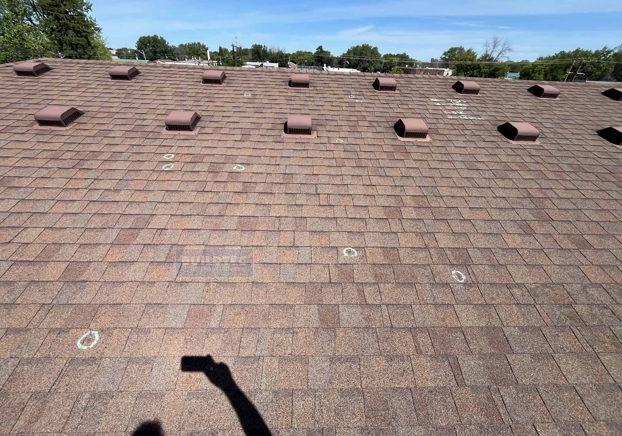 Roofing in Chisago City that shows the hail damage. Roof done by Buildtec.
