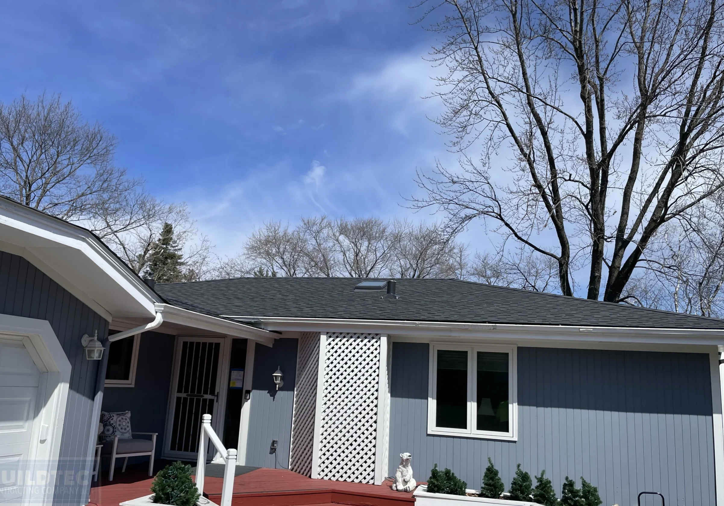 Roofing in White Bear Lake, MN with blue siding.