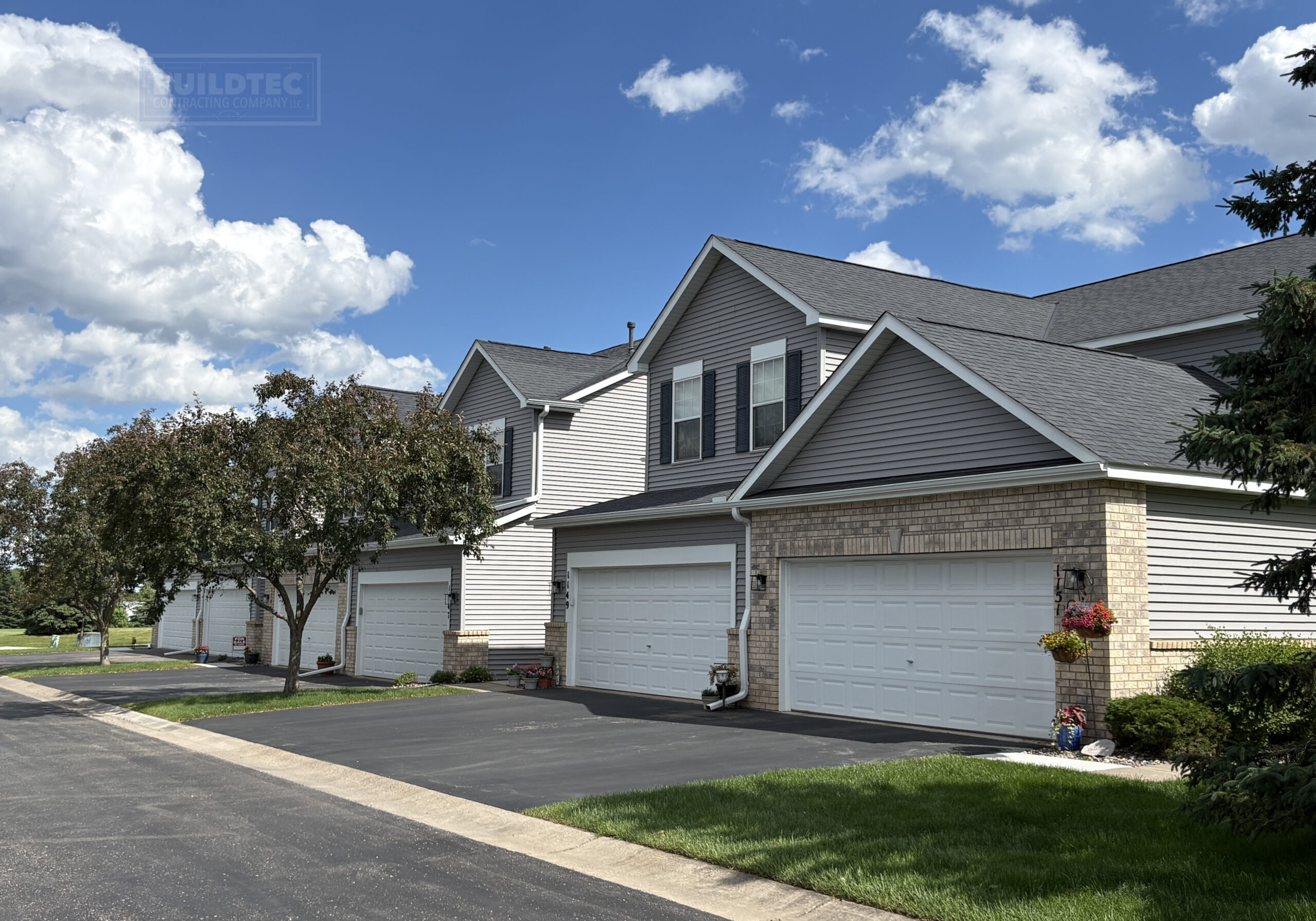 Townhome roof replacements for the Stillwater Crossing HOA in Stillwater MN by Buildtec.
