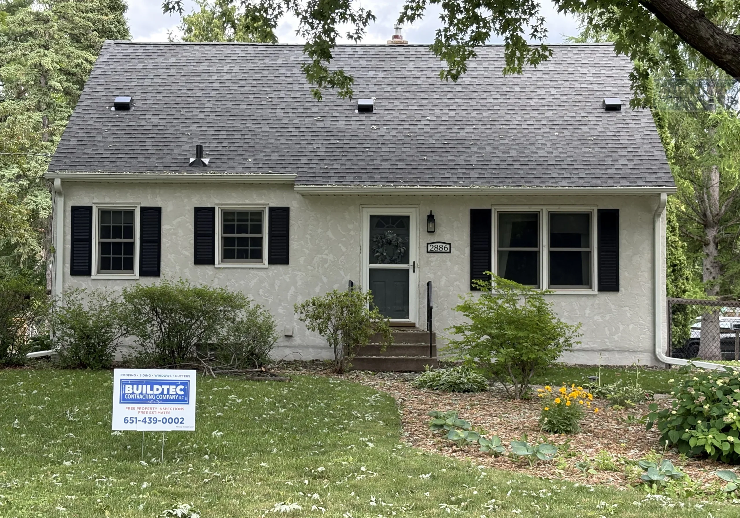 Roofing in Roseville, MN with Buildtec sign